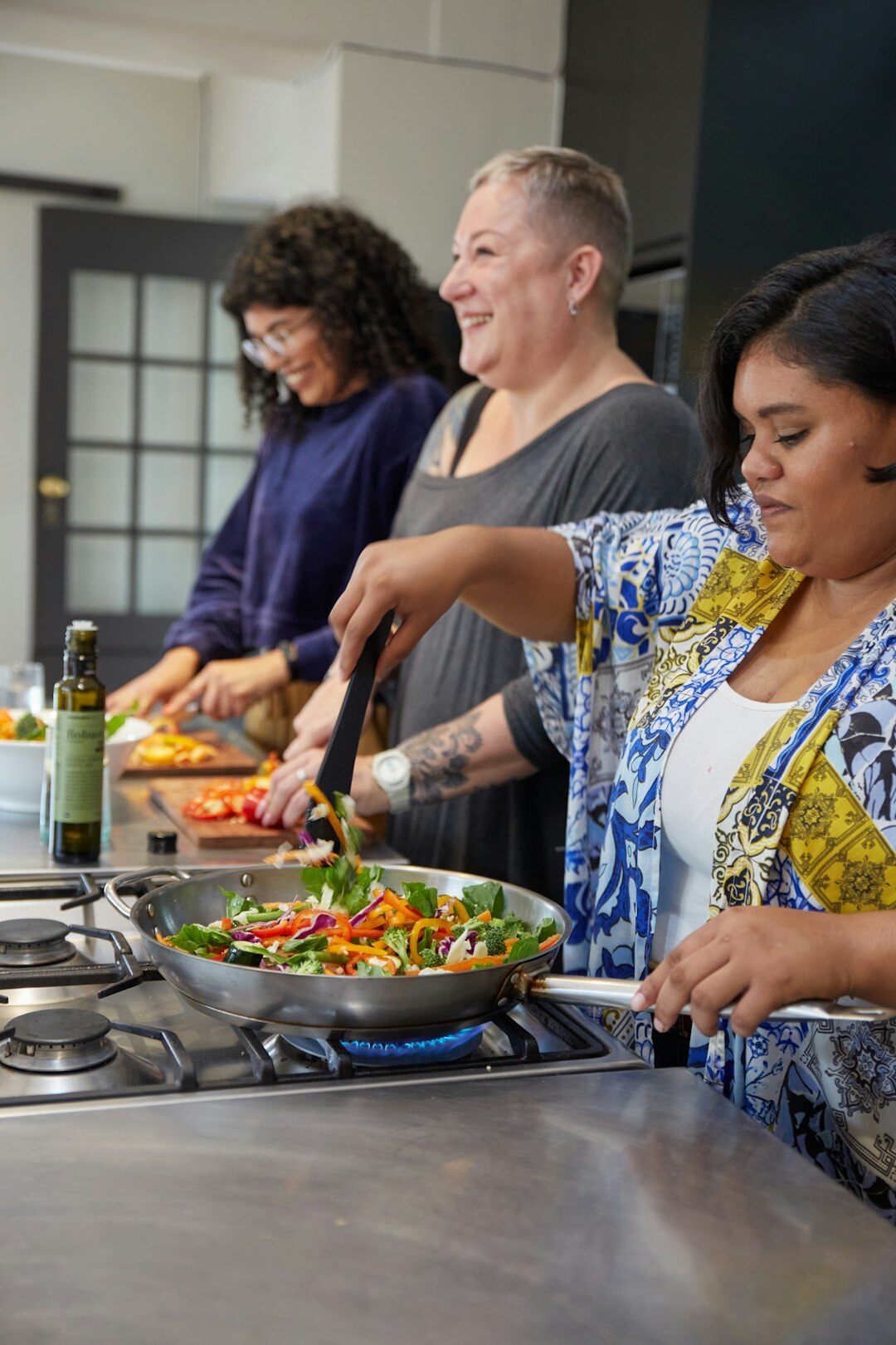 Coworkers cooking together during a team building workshop