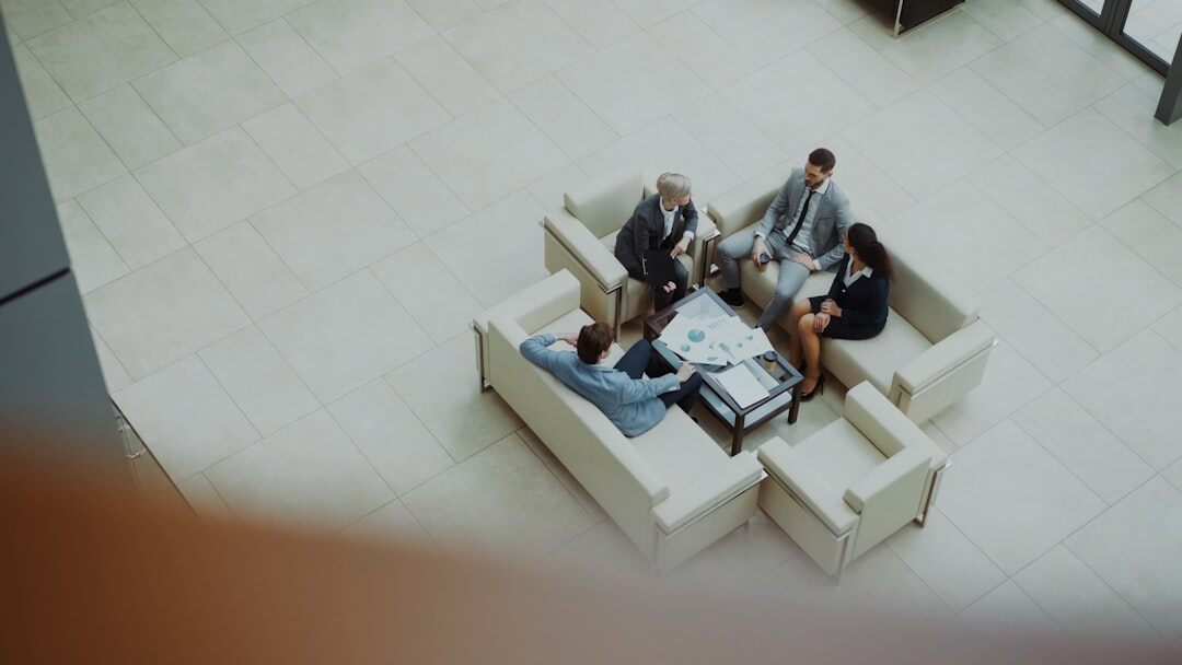 Colleagues playing a strategy board game in a modern office lounge